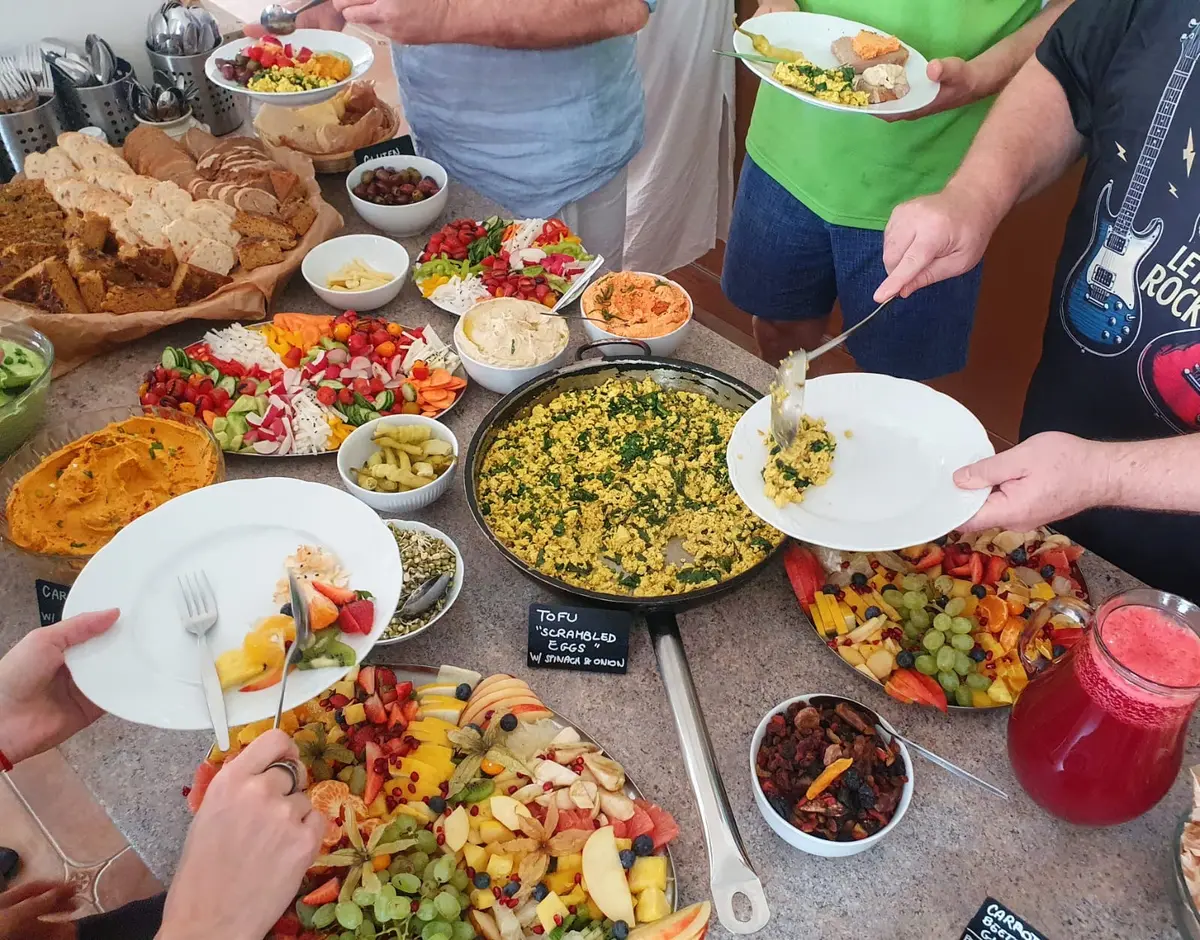 Participants sharing a nourishing vegan breakfast at a previous retreat