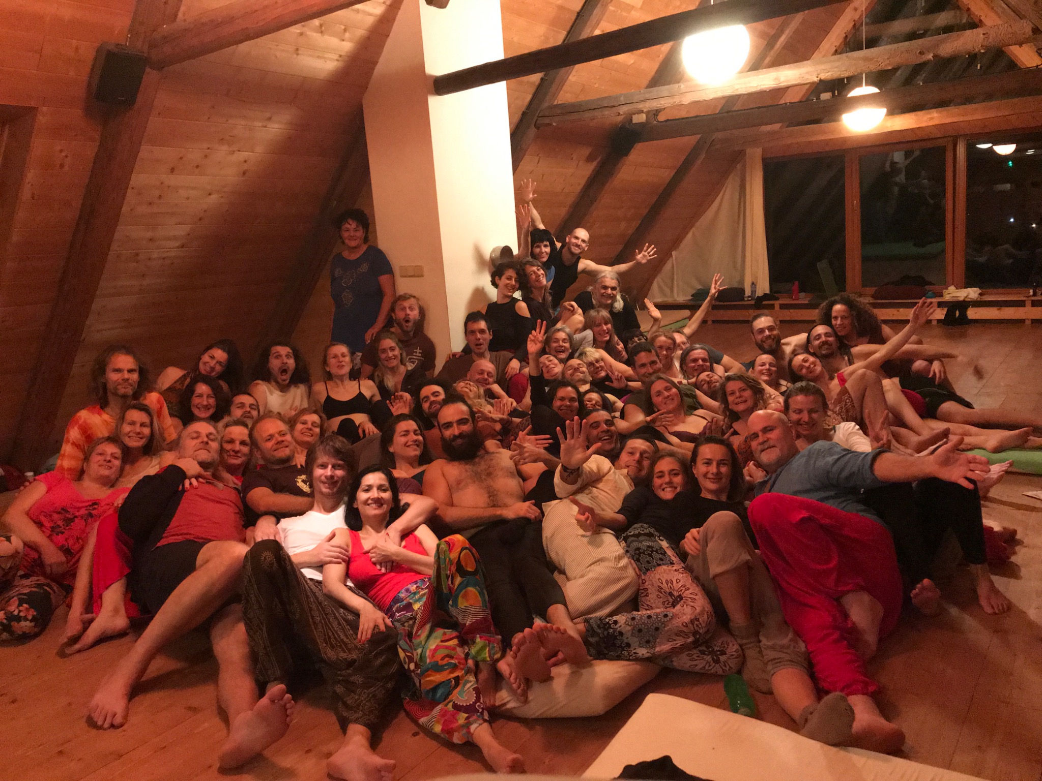 A joyful group of participants gathered together during a retreat